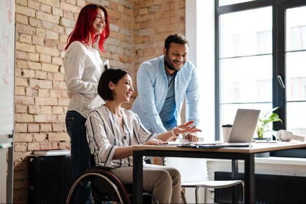 Three-employees-discussing-managing-change.