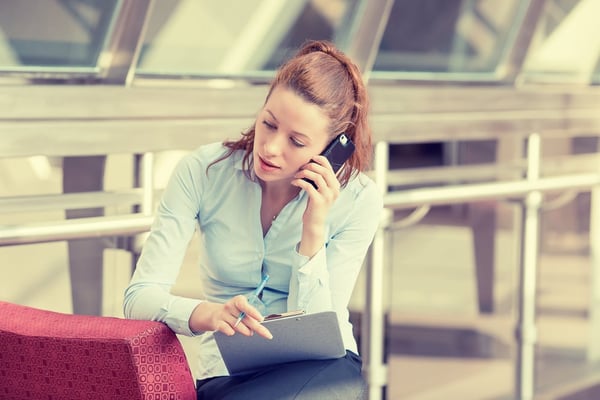 Portrait unhappy young woman talking on mobile phone looking down. Human face expression, emotion, bad news reaction