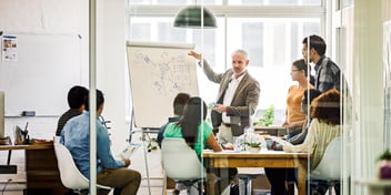 Team discussing change management in an office