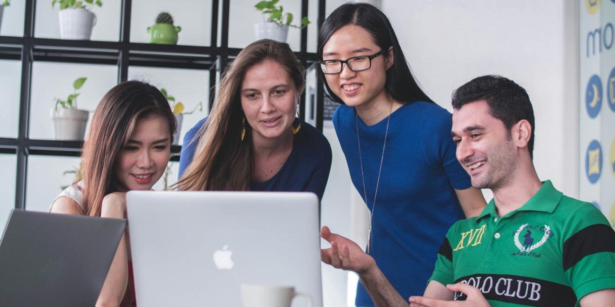 employees looking at a laptop